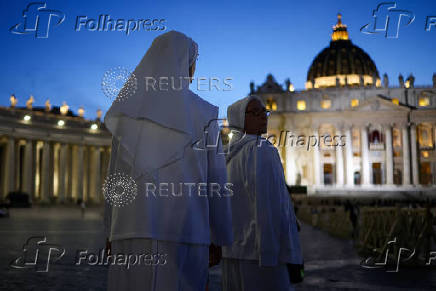 Nuns walk at St. Peter's Square, ahead of the conclave, at the Vatican