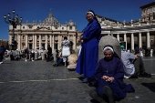 Pope Leo XIV leads the Regina Caeli prayer from his window in St. Peter's Square, at the Vatican