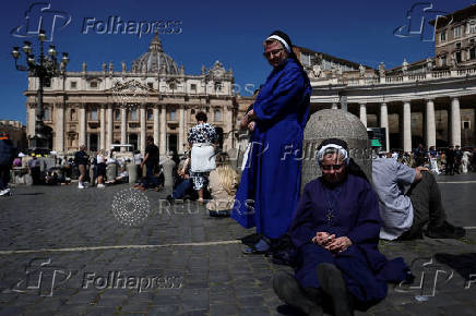Pope Leo XIV leads the Regina Caeli prayer from his window in St. Peter's Square, at the Vatican