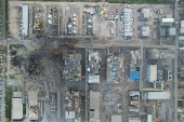 Rescuers work at the explosion site at a chemical plant in Gaomi