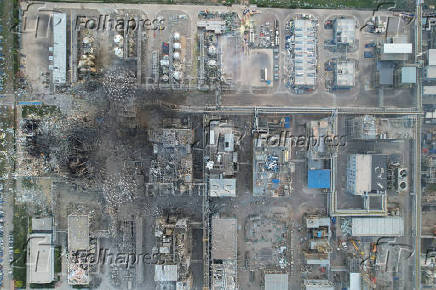 Rescuers work at the explosion site at a chemical plant in Gaomi