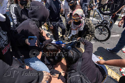 Standoff by protesters and law enforcement, following multiple detentions by ICE in Los Angeles County