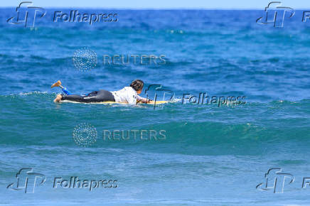 Surfer Mireia Cabanes tries to surf a wave during the adaptive surfing Open LPA Surf City No Limit in Las Palmas de Gran Canaria