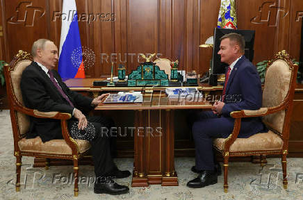 FILE PHOTO: Russian Minister of Transport Roman Starovoit attends a meeting with Russian President Vladimir Putin, in Moscow