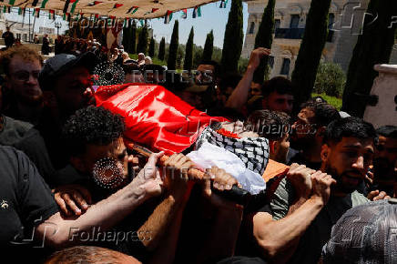 Mourners take part in the funeral of of Sayfollah Kamel Musallet, killed amid the Israel-Gaza conflict, near Ramallah