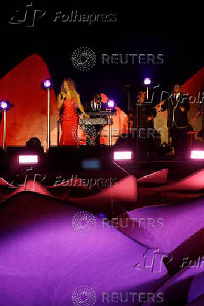 Mariah Carey performs on a floating stage shaped like a giant Victoria amazonica water lily at the Guama River in Belem