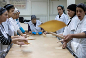 Ultra-Orthodox Jews prepare matza for the upcoming Jewish holiday of Passover