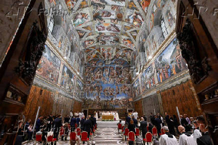 FILE PHOTO: FILE PHOTO: Pope Francis conducts a Mass in the Sistine Chapel at the Vatican