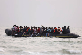 Migrant dinghy heads off the French coast to cross the English channel