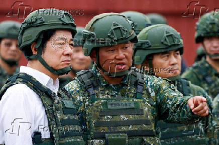 A soldier speaks to Taiwan's President Lai Ching-te in Hsinchu