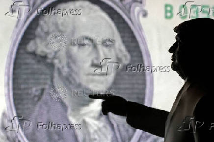 FILE PHOTO: Illustration shows 3D-printed miniature model depicting U.S. President Donald Trump and representation of U.S. dollar banknote