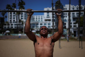 A man exercises at Muscle Beach in Santa Monica
