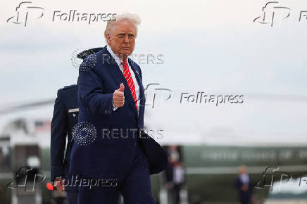 U.S. President Trump boards Air Force One, at Joint Base Andrews