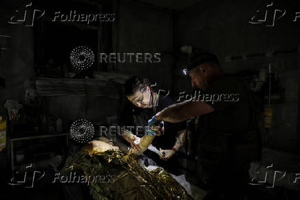 Ukrainian Armed Forces combat medics treat injured servicemen near Chasiv Yar