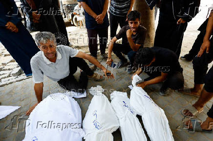 Palestinians mourn loved ones killed in Israel strike, in Gaza City