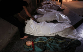 Bodies of Palestinians killed in an Israeli strike, at Al-Ahli Arab Baptist hospital, in Gaza City