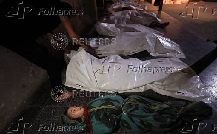 Bodies of Palestinians killed in an Israeli strike, at Al-Ahli Arab Baptist hospital, in Gaza City