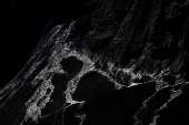 Debris and dust from a crumbling glacier that partially collapsed and tumbled onto the village of Blatten