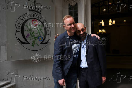 Former UBS and Citigroup trader Tom Hayes and former Barclays trader Carlo Palombo celebrate after their conviction for manipulating the LIBOR benchmark was overturned