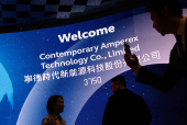 Guests pose for photos during the Contemporary Amperex Technology (CATL)  listing ceremony at the Hong Kong Stock Exchange in Hong Kong
