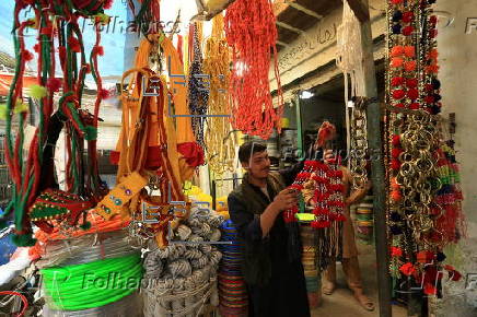 Roadside shop sells ornaments ahead of Eid al-Adha in Peshawar