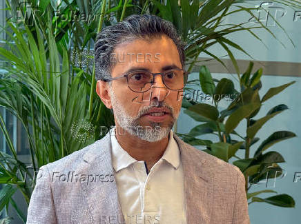 United Arab Emirates' Minister of Energy Suhail Mohamed Al Mazrouei speaks with reporters in Vienna