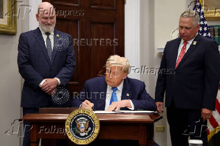 U.S. President Trump signs the VA Home Loan Program Reform Act at the White House in Washington, D.C.