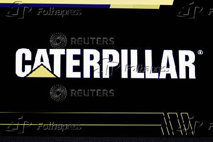 FILE PHOTO: The company logo for Caterpillar is displayed on a screen on the floor at the NYSE in New York