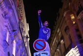 Champions League - Fans celebrate after Paris St Germain qualifies for the final