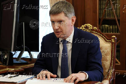 FILE PHOTO: Russian President Vladimir Putin meets with Economic Development Minister Maxim Reshetnikov in Moscow