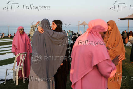 Israeli Muslims pray on the first day of the Muslim holiday of Eid al-Adha by the sea side of the Mediterranean, in Jaffa