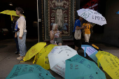 Demonstrators gather during a 