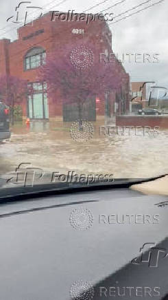 A building is seen partially submerged in flood waters after flash floods, in Nashville