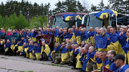 Ukrainian POWs are seen after a swap at an unknown location in Ukraine