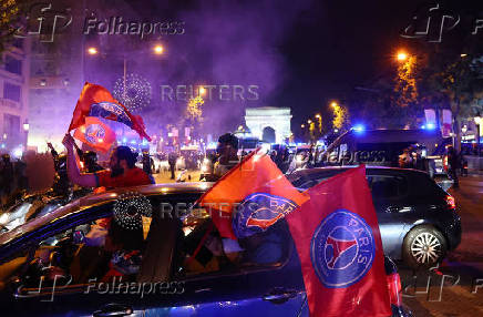 Champions League - Fans celebrate after Paris St Germain qualifies for the final