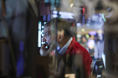 A trader works on the floor at the New York Stock Exchange (NYSE) in New York City