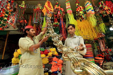 Roadside shop sells ornaments ahead of Eid al-Adha in Peshawar