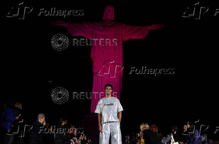Models present creations by Alessa at the Christ the Redeemer statue to mark the launch of Rio Fashion Show, in Rio de Janeiro