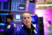 Traders work on the floor of the NYSE in New York