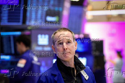 Traders work on the floor of the NYSE in New York