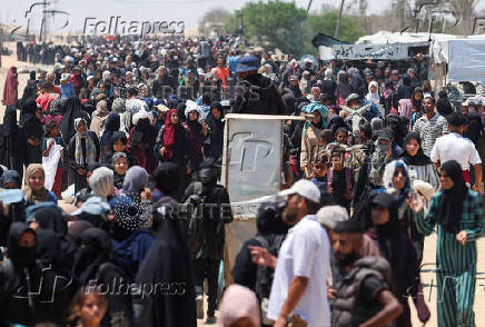 FILE PHOTO: Palestinians seek aid from the U.S.-backed Gaza Humanitarian Foundation, near Rafah