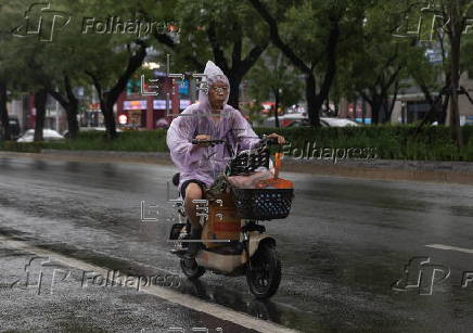 Daily life amid rain in Beijing