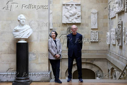 Victoria and Nicholas Howard, who currently run the Castle Howard, pose for a photograph near the renovated Grand Staircase of the castle, in York