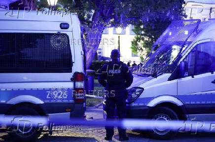 Polish police secure an earea at the Warsaw University after an attack with an axe