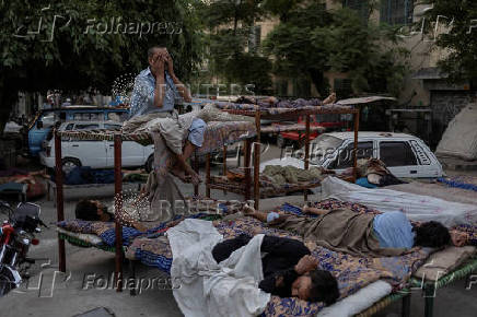 Residents shelter outdoors during heatwave in Rawalpindi, Pakistan