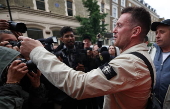 Political activist Tommy Robinson faces court over journalist harassment
