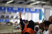 Muslim pilgrims hurl stones during 'stoning of the devil' ritual, in Mina
