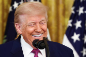 U.S. President Trump signs a resolution at the White House