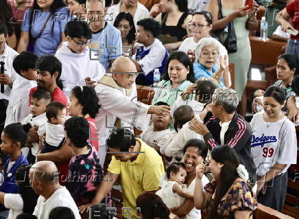 Mass baptism ceremony for children in Bacoor city