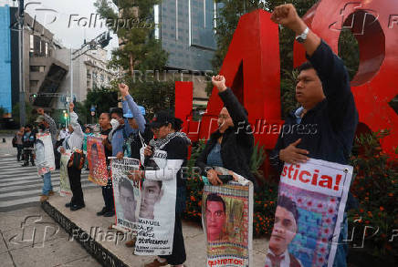 Demonstrators march to demand justice for the disappearance of students of Ayotzinapa Rural Teachers' College, in Mexico City
